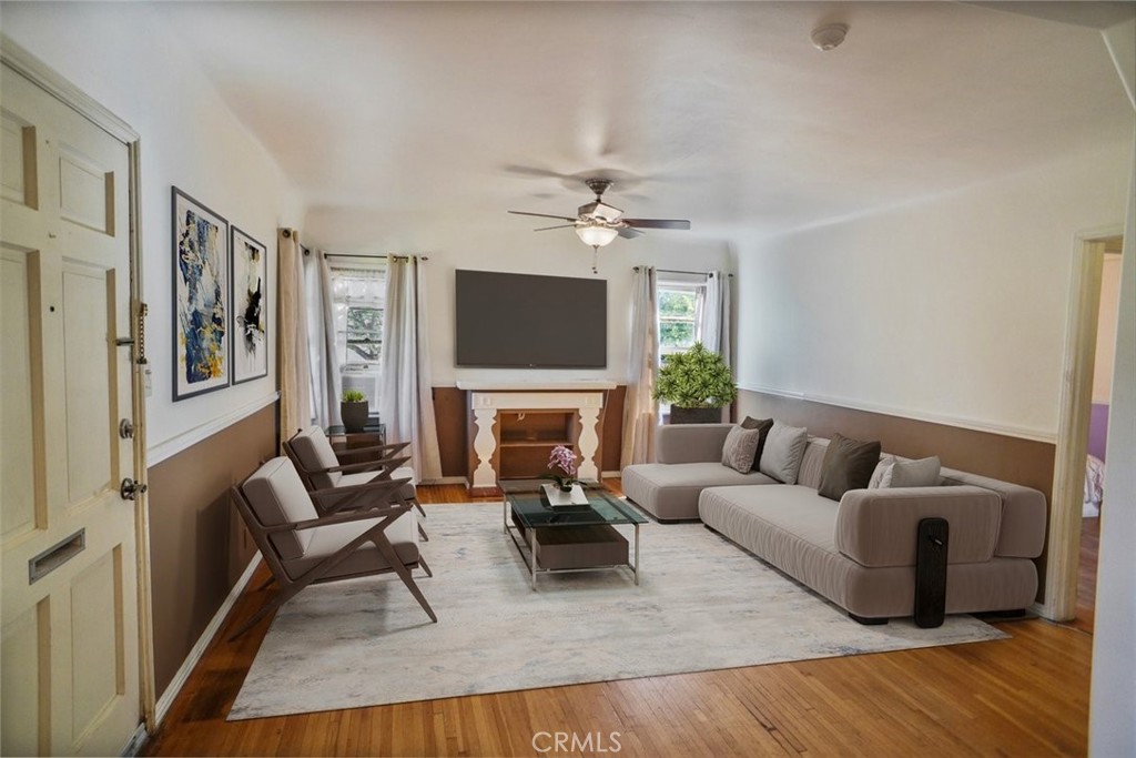 10007 Haddon Avenue Pacoima, CA 91331 - Photo 6 of 22 a living room with furniture and a fireplace