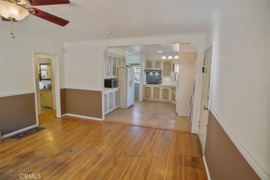 10007 Haddon Avenue Pacoima, CA 91331 - Photo 9 of 22 a view of a kitchen with wooden floor and a kitchen