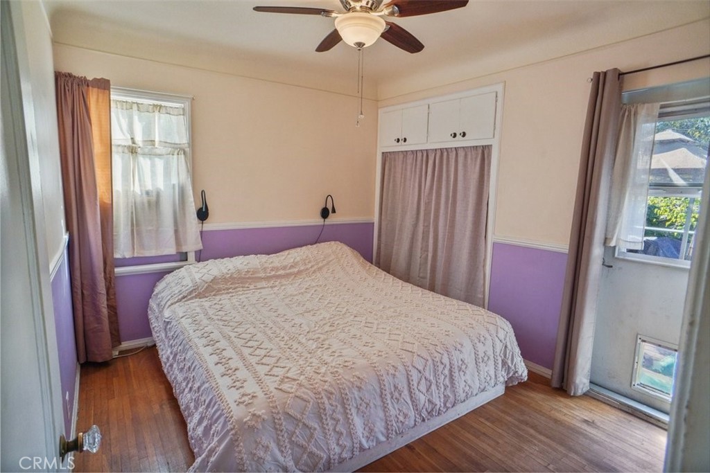 10007 Haddon Avenue Pacoima, CA 91331 - Photo 10 of 22 a bedroom with a bed and a chandelier