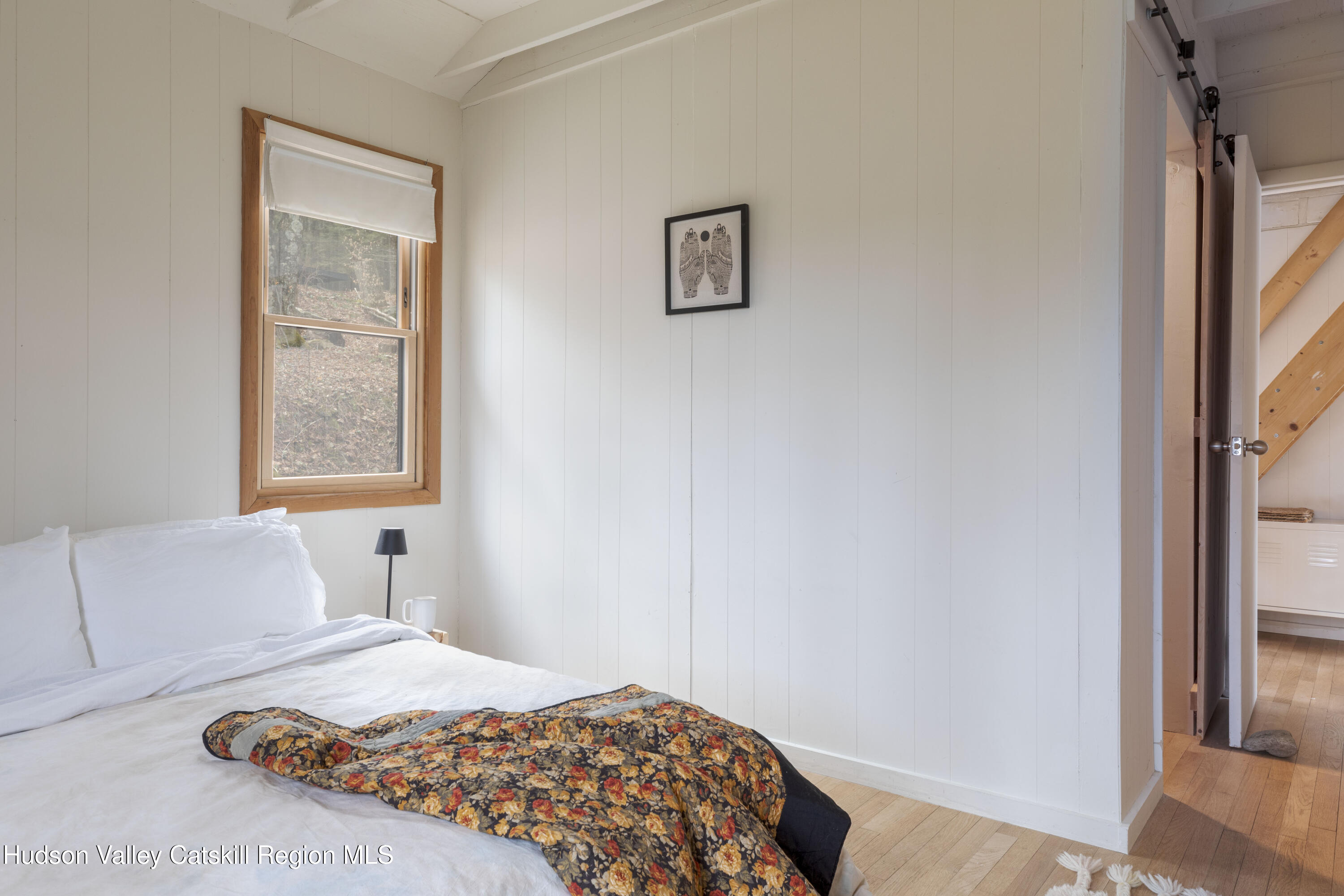 44 Smith Lane Grahamsville, NY 12740 - Photo 16 of 34 a bedroom with a bed and a window