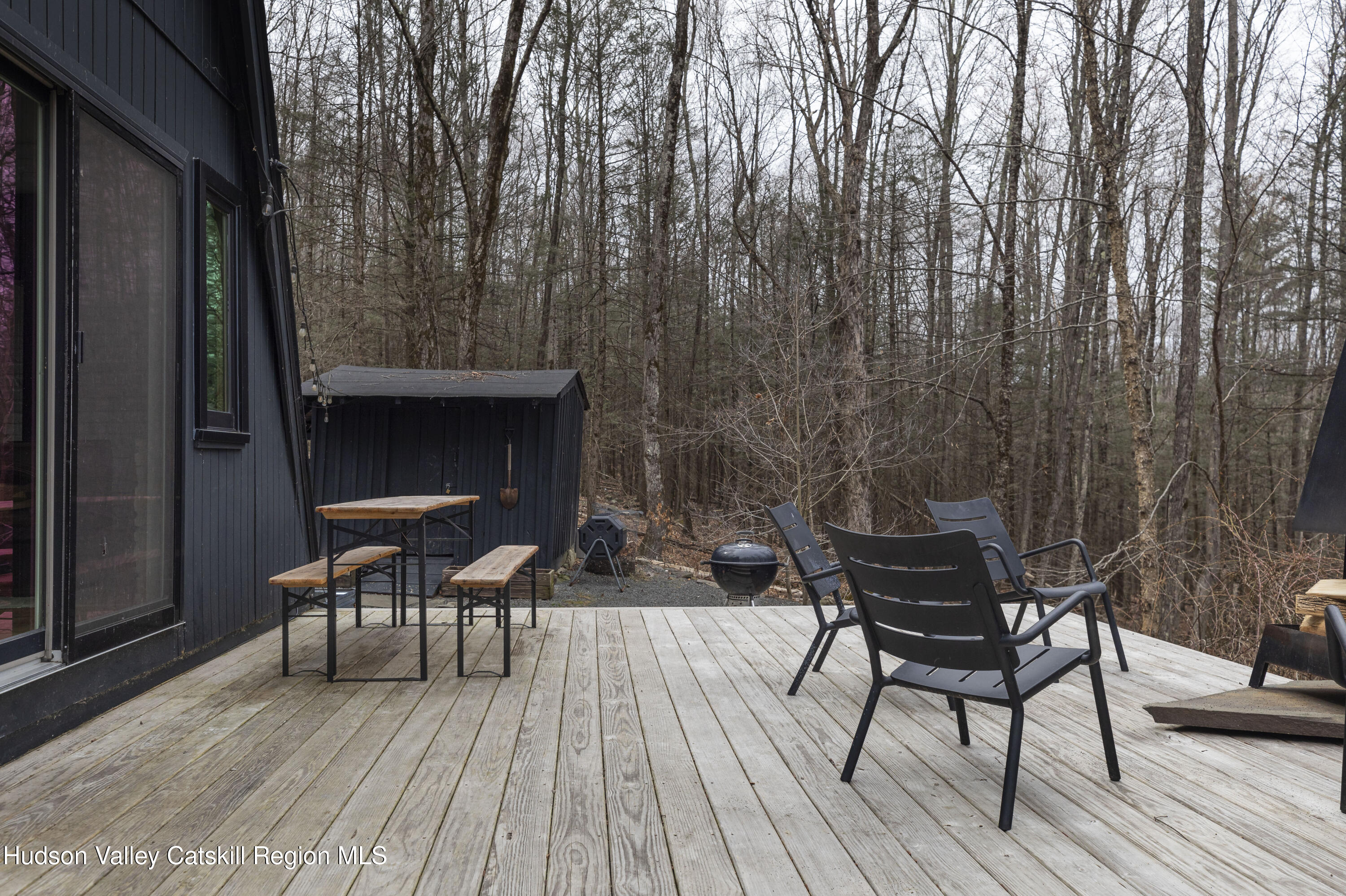 44 Smith Lane Grahamsville, NY 12740 - Photo 27 of 34 a view of a chairs and table on the deck with wooden floor