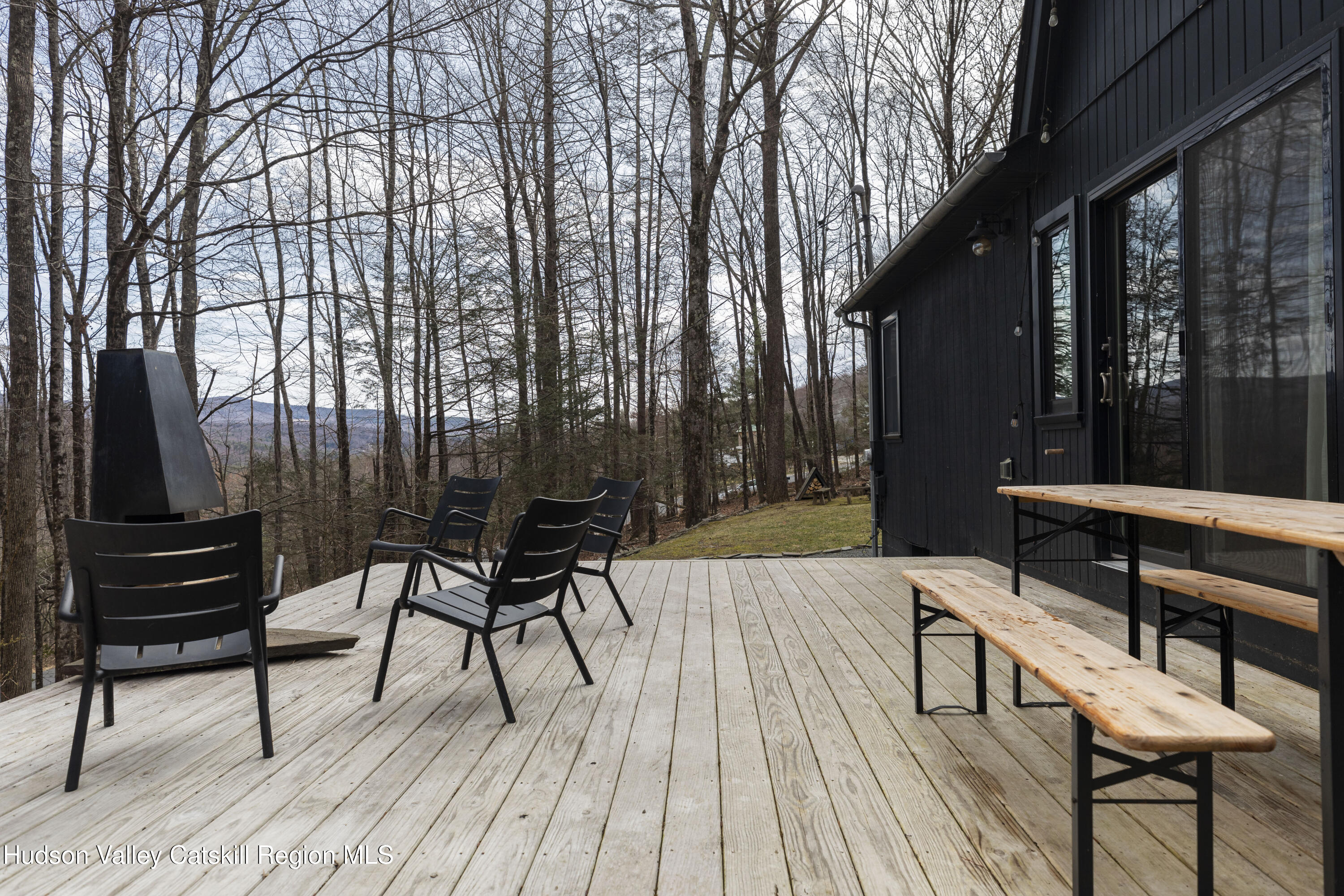 44 Smith Lane Grahamsville, NY 12740 - Photo 28 of 34 a view of a chairs and table on the wooden deck