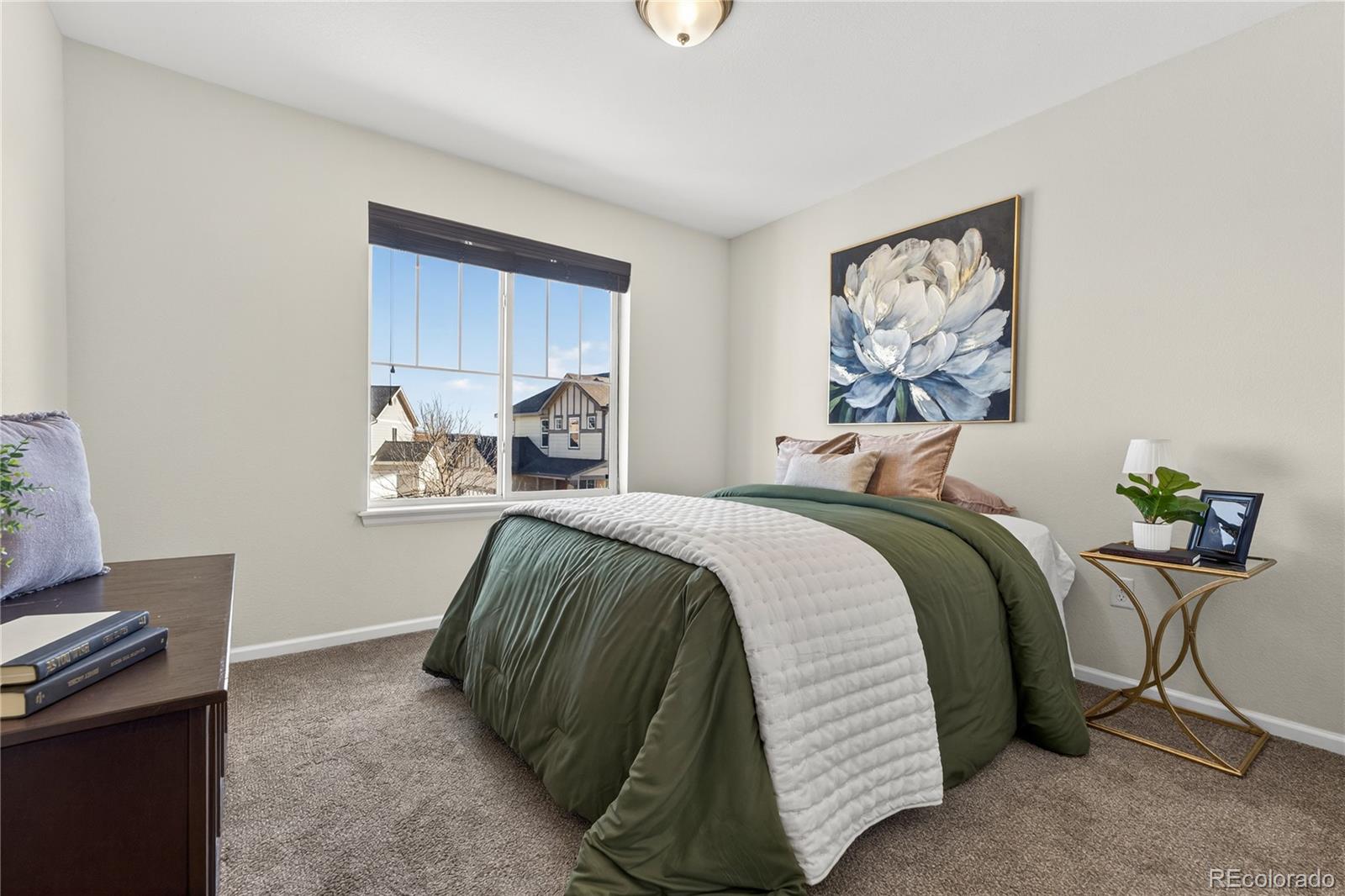 10180 Audrey Street Firestone, CO 80504 - Photo 27 of 46 a bedroom with a bed and a window