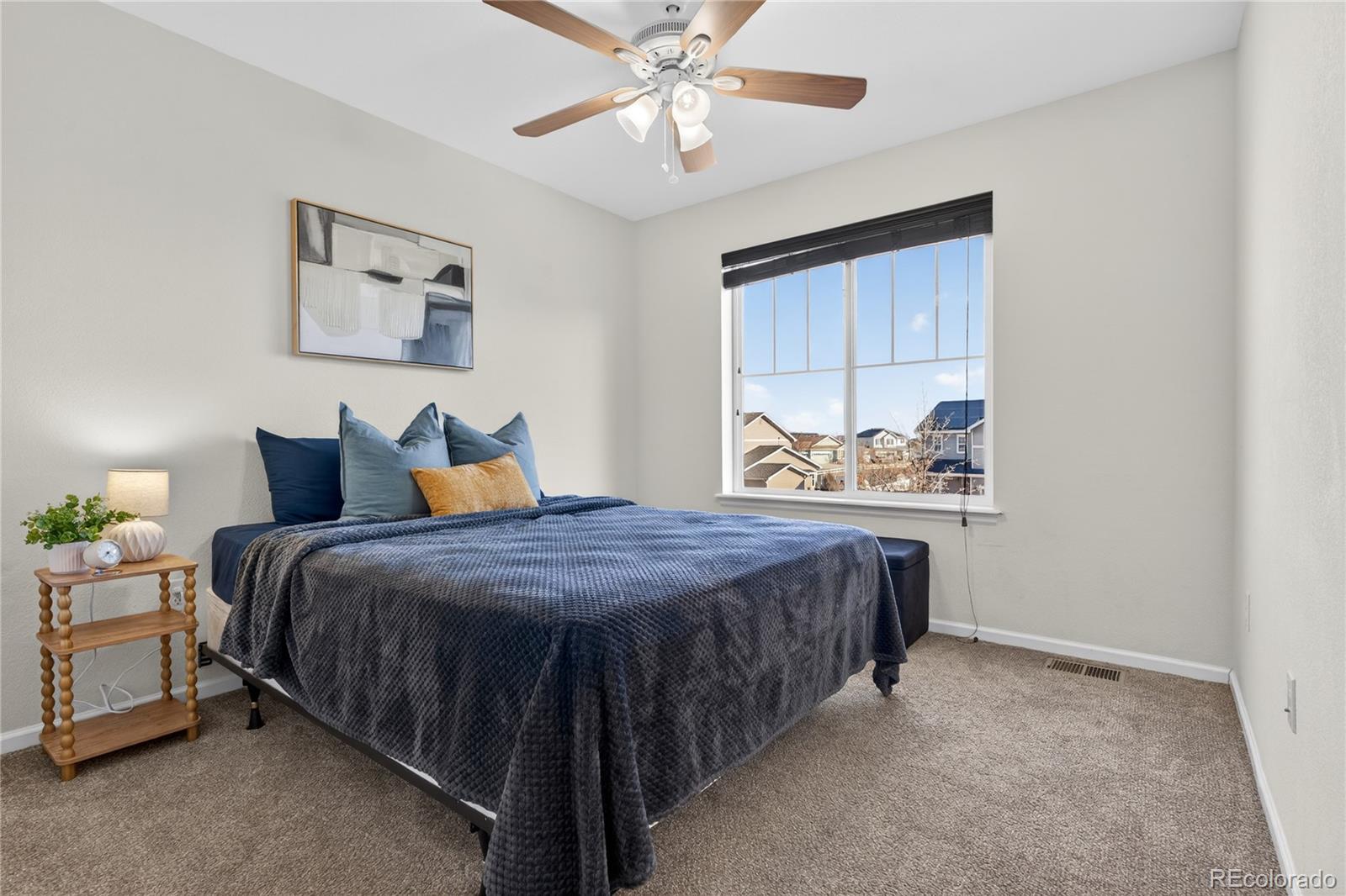 10180 Audrey Street Firestone, CO 80504 - Photo 30 of 46 a bedroom with a bed and a window