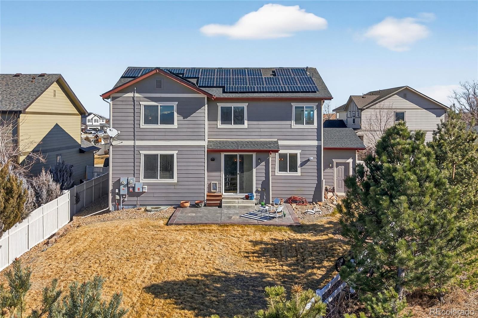 10180 Audrey Street Firestone, CO 80504 - Photo 38 of 46 a front view of a house with a yard