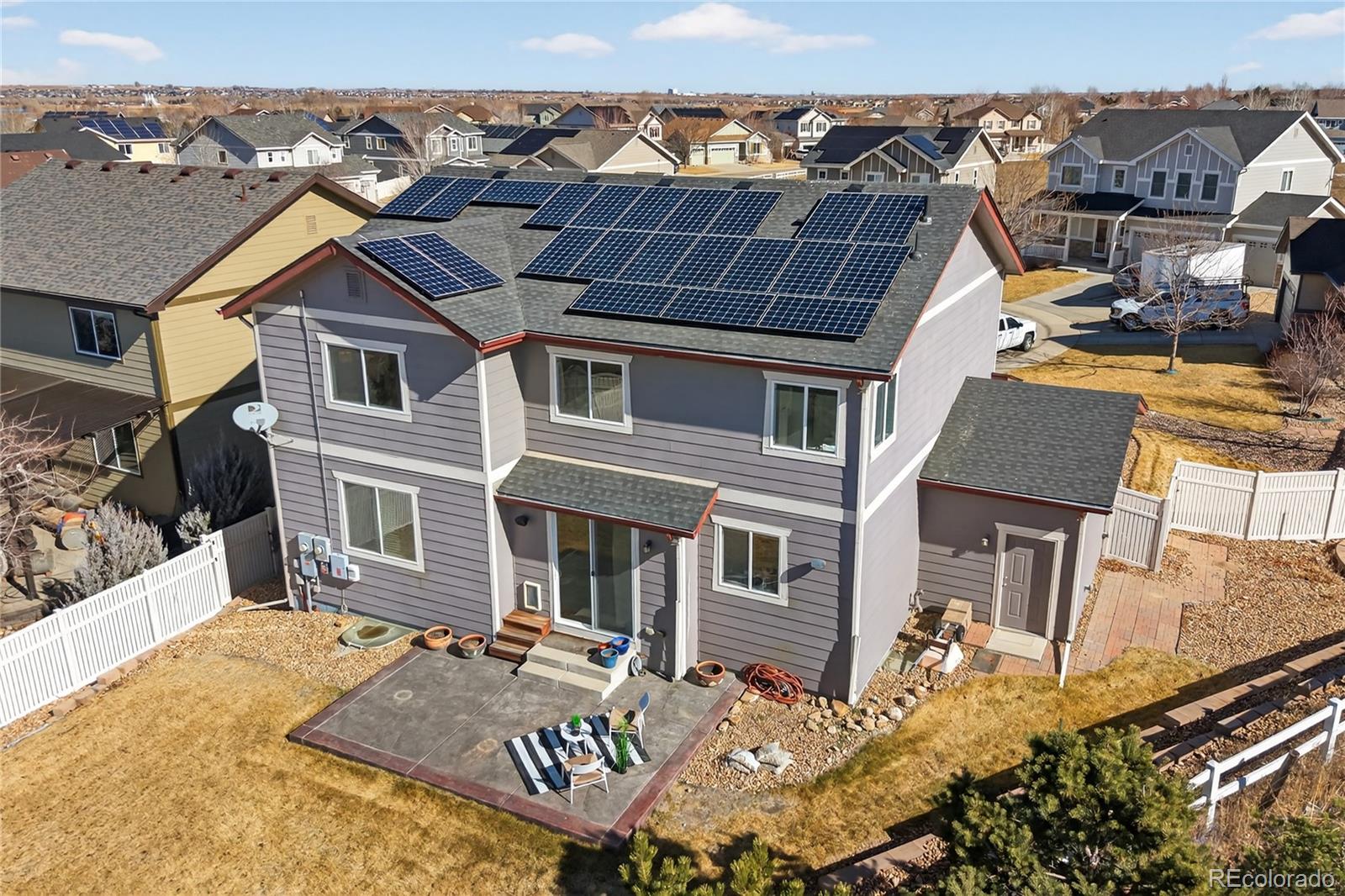 10180 Audrey Street Firestone, CO 80504 - Photo 39 of 46 front view of a house with a yard