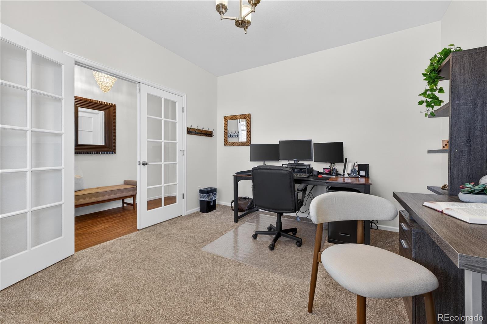 10180 Audrey Street Firestone, CO 80504 - Photo 8 of 46 a view of a workspace with furniture and a window