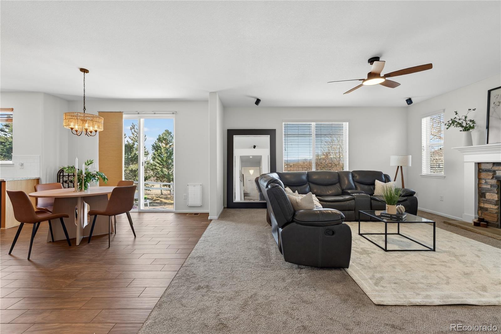 10180 Audrey Street Firestone, CO 80504 - Photo 9 of 46 a living room with furniture a dining table and a window