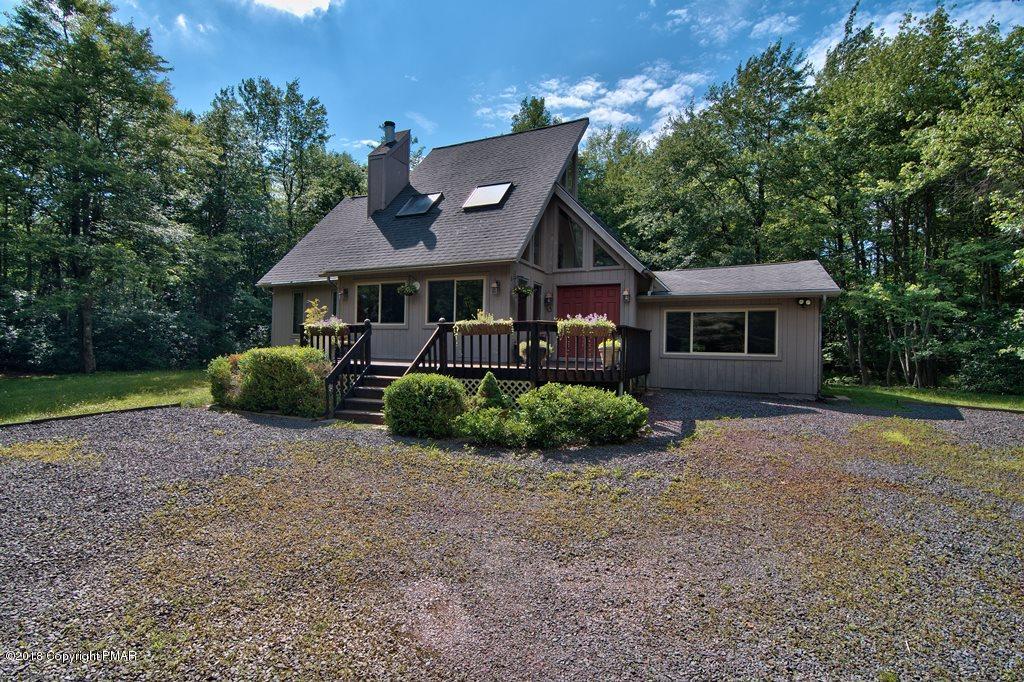 131 Powderhorn Road Long Pond, PA 18334 - Photo 1 of 54 a front view of a house with a yard