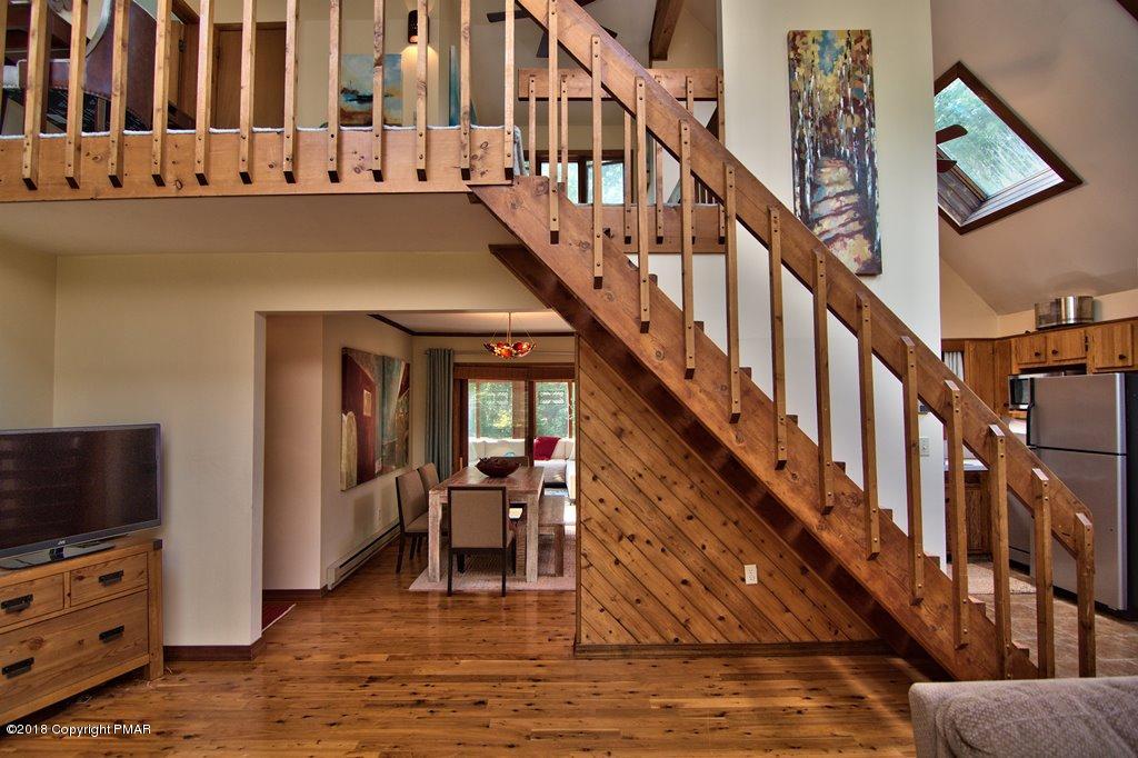 131 Powderhorn Road Long Pond, PA 18334 - Photo 11 of 54 a view of entryway and hall with wooden floor