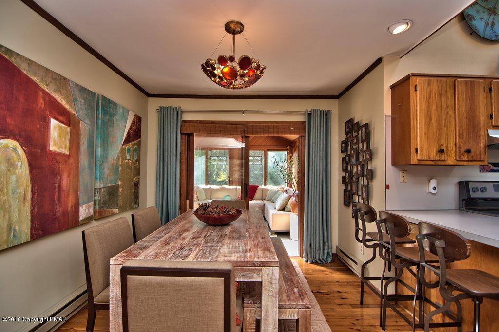 131 Powderhorn Road Long Pond, PA 18334 - Photo 15 of 54 a dining room with a table chairs and entryway