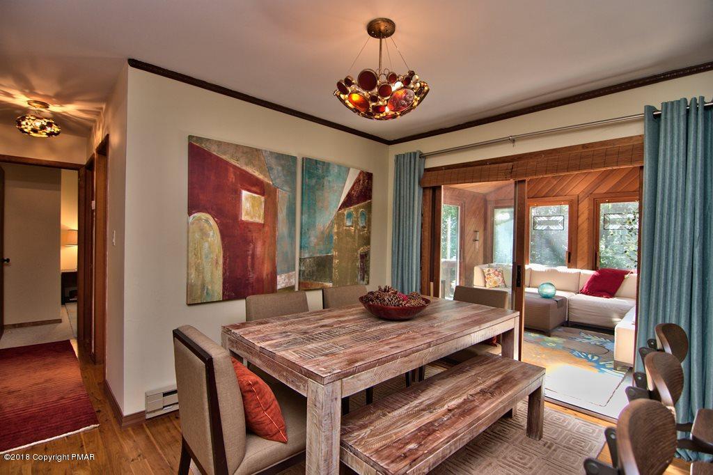 131 Powderhorn Road Long Pond, PA 18334 - Photo 16 of 54 a living room with furniture and a large window