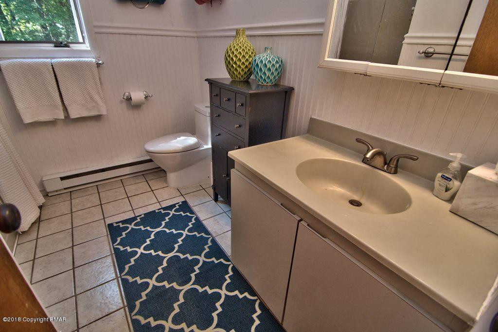 131 Powderhorn Road Long Pond, PA 18334 - Photo 32 of 54 a bathroom with a sink toilet and shower