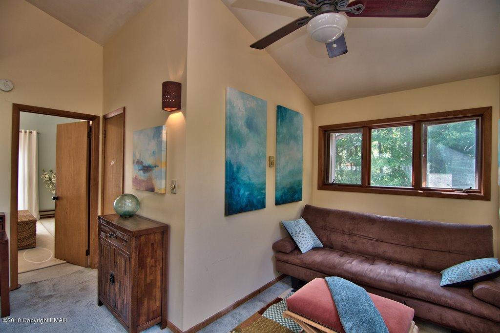 131 Powderhorn Road Long Pond, PA 18334 - Photo 39 of 54 a living room with furniture and a large window