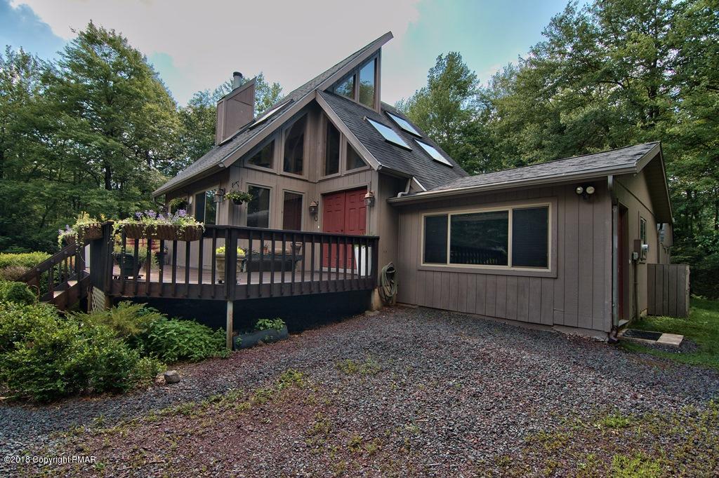 131 Powderhorn Road Long Pond, PA 18334 - Photo 4 of 54 a view of a house with a yard and a fence