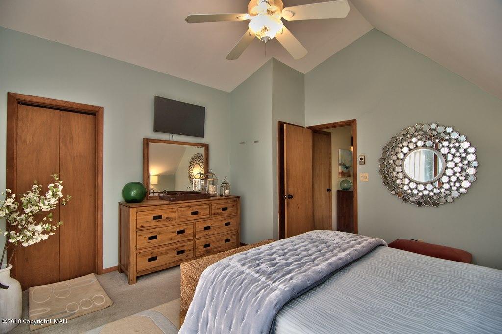 131 Powderhorn Road Long Pond, PA 18334 - Photo 45 of 54 a bedroom with a bed and a dresser