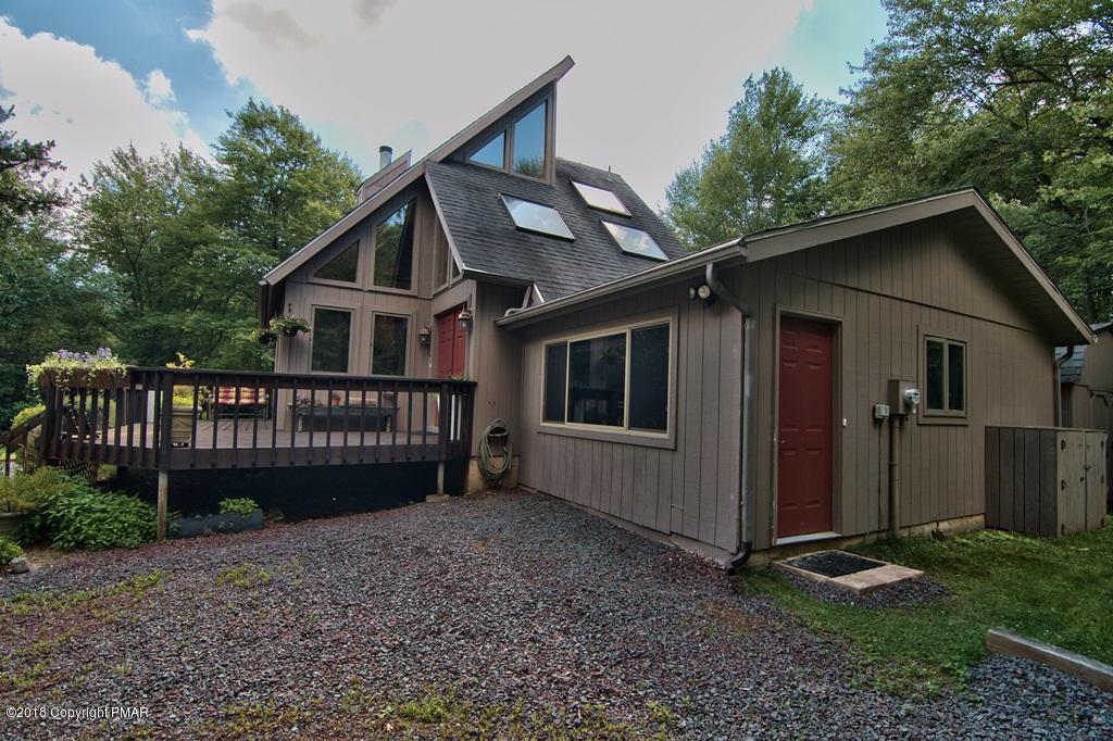 131 Powderhorn Road Long Pond, PA 18334 - Photo 50 of 54 a view of a house with a yard and wooden fence