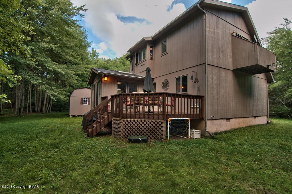 131 Powderhorn Road Long Pond, PA 18334 - Photo 52 of 54 a view of a house with a yard and deck