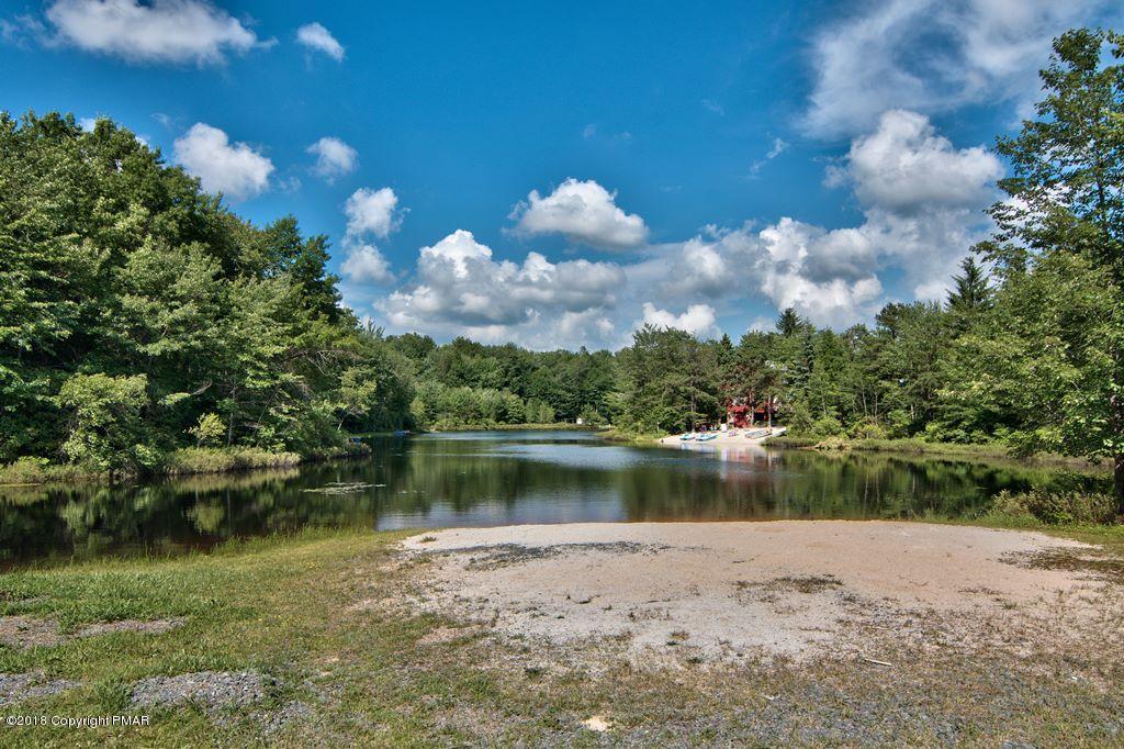 131 Powderhorn Road Long Pond, PA 18334 - Photo 54 of 54 a view of a lake with a yard