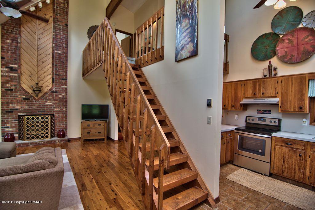 131 Powderhorn Road Long Pond, PA 18334 - Photo 7 of 54 a view of a livingroom with furniture and staircase