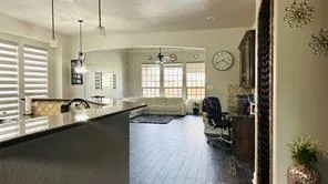 a kitchen with a sink and a stove top oven