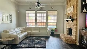 a living room with furniture and a fireplace