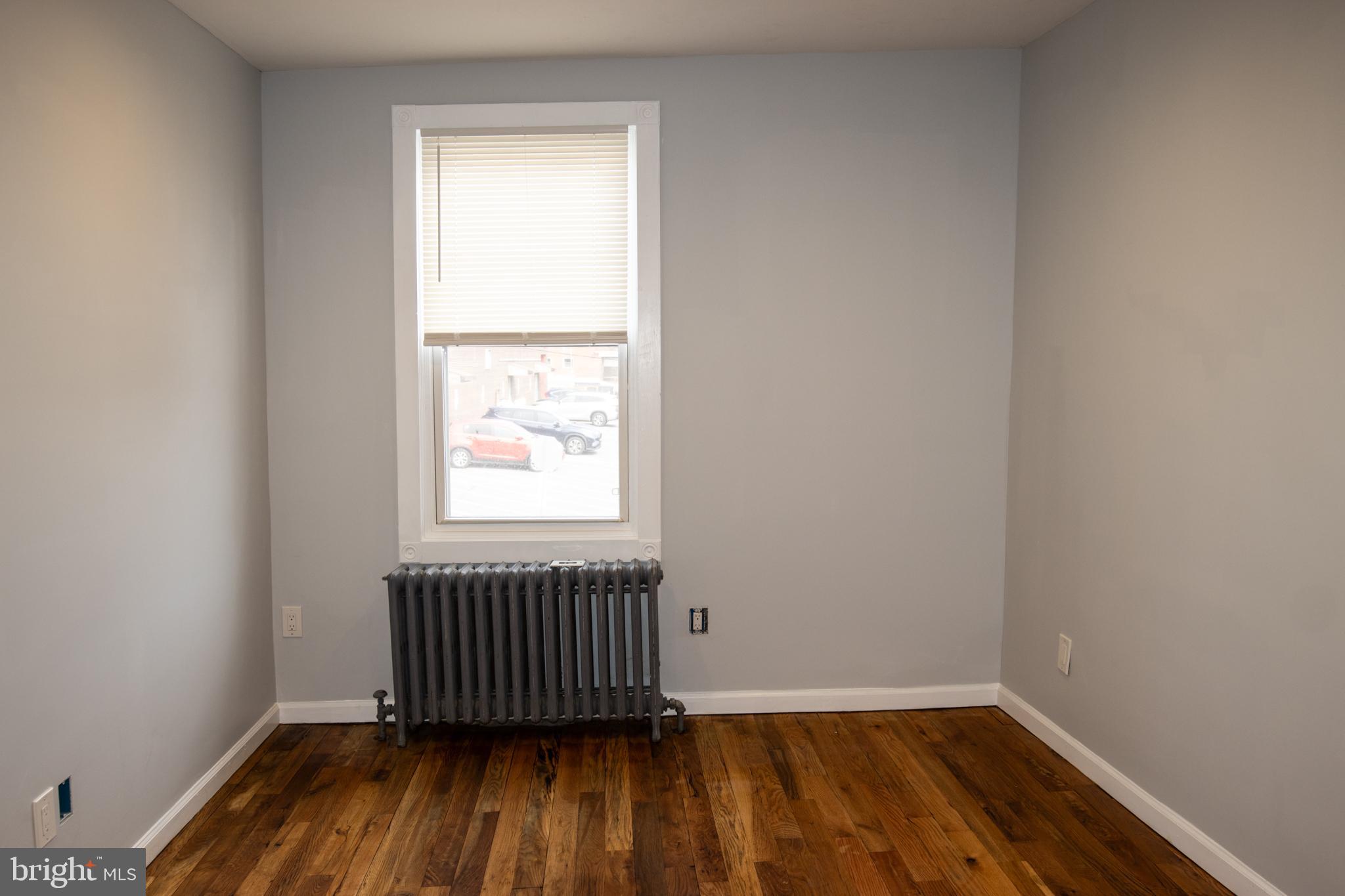 321 North 3rd Street Pottsville, PA 17901 - Photo 20 of 40 a view of empty room with wooden floor and fan