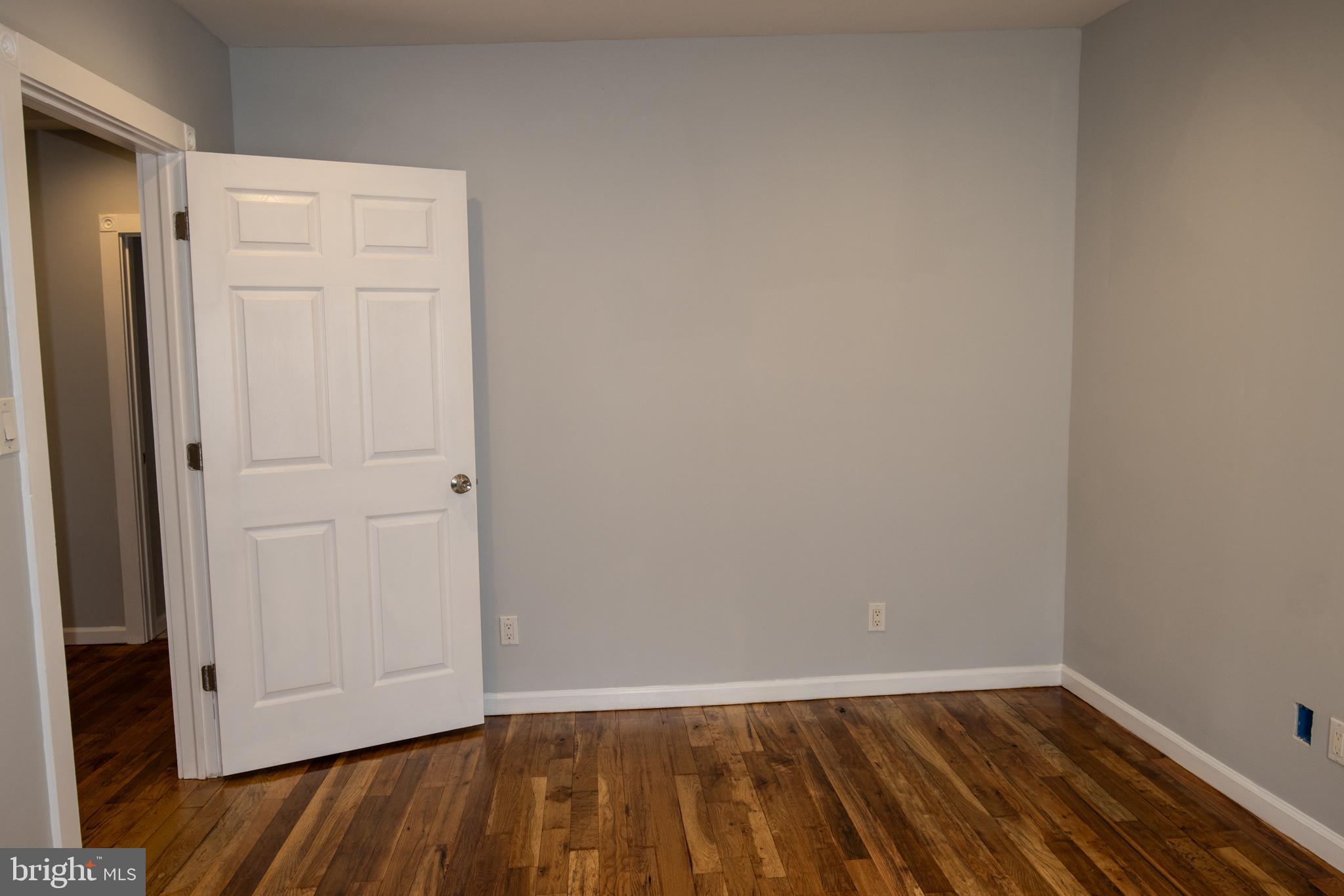 321 North 3rd Street Pottsville, PA 17901 - Photo 26 of 40 a view of an empty room with closet and wooden floor