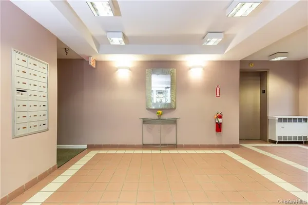 a view of a hallway with entryway window and couch