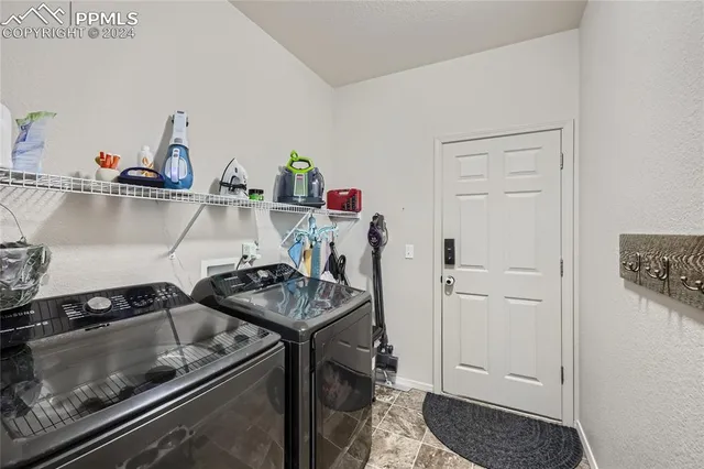 a kitchen with a stove and a refrigerator
