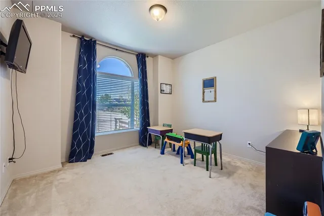 a workspace with furniture and window