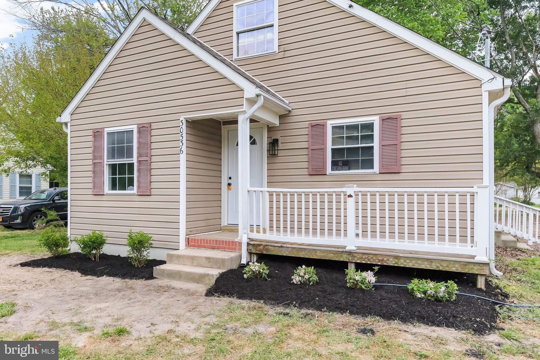 Charming cottage with inviting porch.