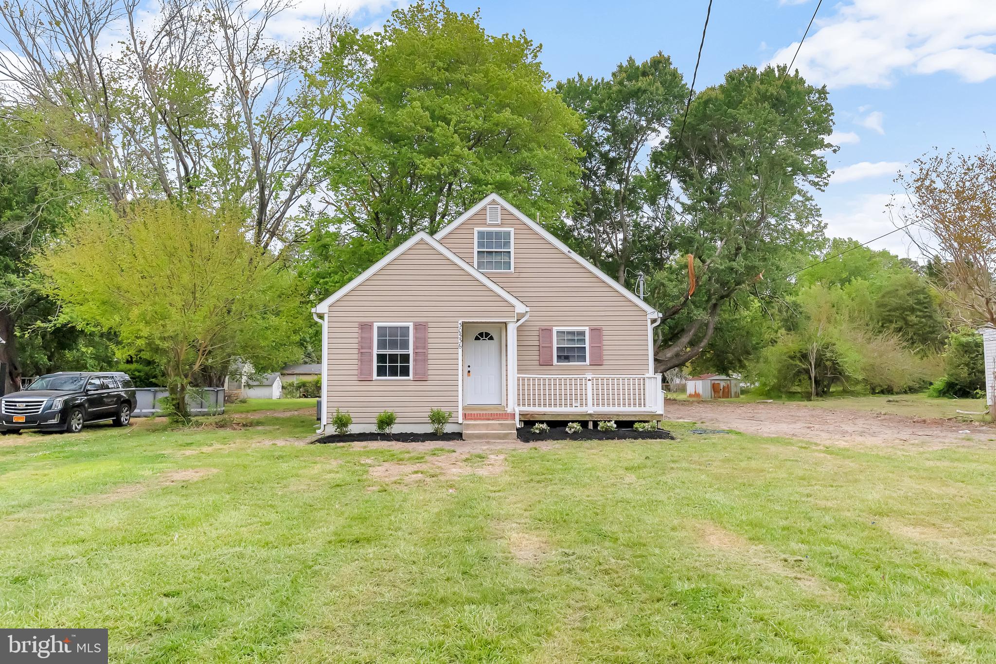 30536 Bennett Road Salisbury, MD 21804 - Photo 25 of 27 Charming home with lush greenery backdrop.