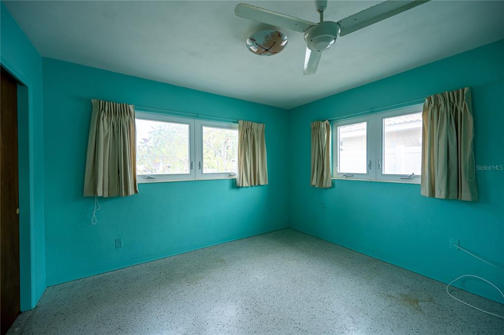1425 Corey Way South South Pasadena, FL 33707 - Photo 23 of 34 an empty room with windows and fan