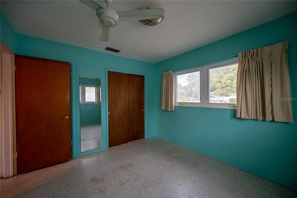 1425 Corey Way South South Pasadena, FL 33707 - Photo 24 of 34 an empty room with windows and closet