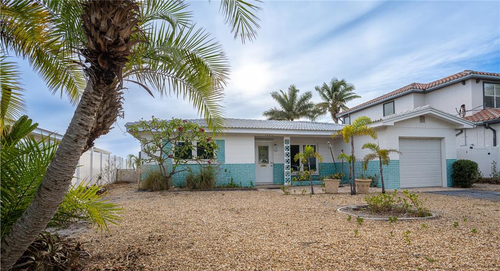 1425 Corey Way South South Pasadena, FL 33707 - Photo 29 of 34 a front view of house with yard and green space