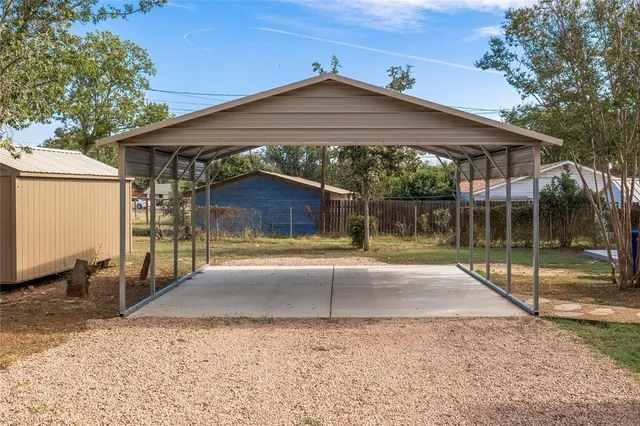 a view of a house with backyard and a patio