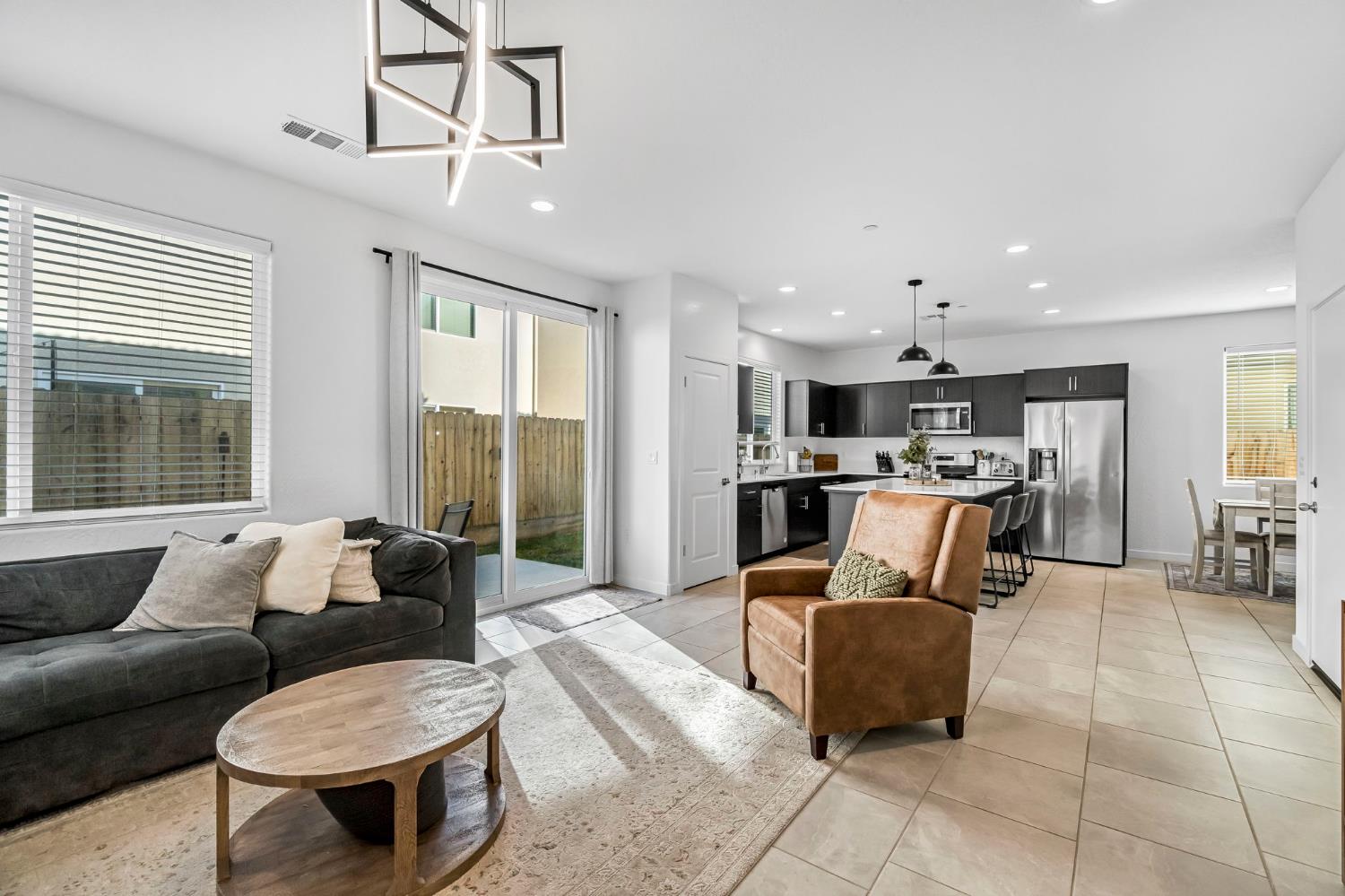 367 Talus Way South Madera, CA 93636 - Photo 16 of 40 a living room with furniture and kitchen view
