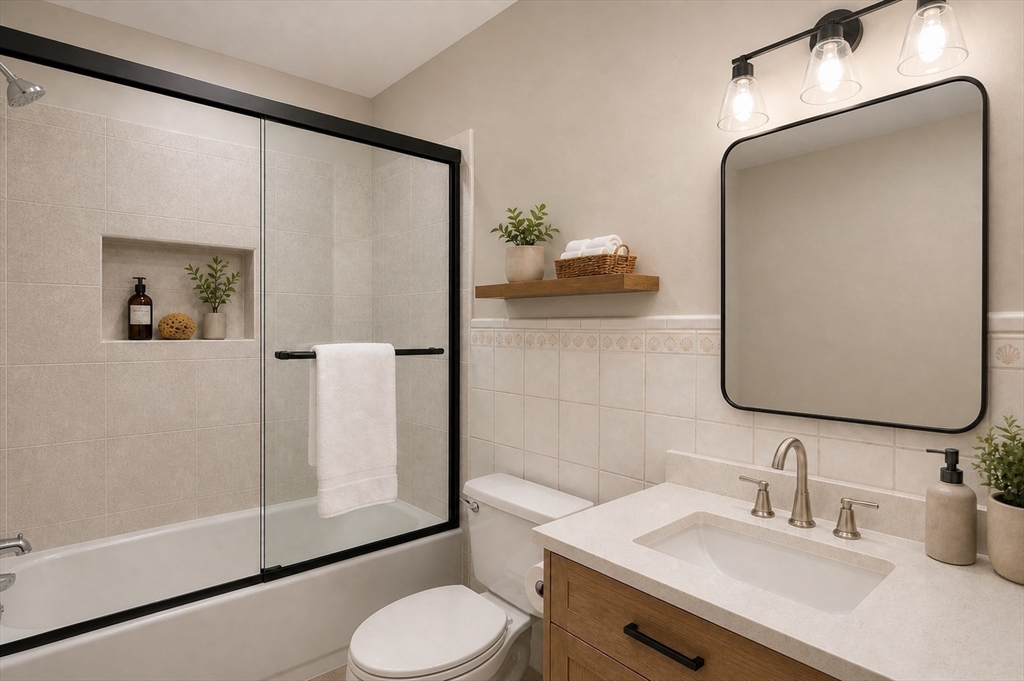 67 Wituwamat Road Weymouth, MA 02191 - Photo 15 of 42 a bathroom with a sink toilet and shower