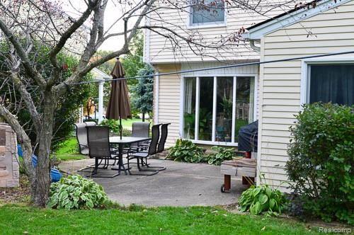 990 Dahlia Lane Rochester, MI 48307 - Photo 9 of 35 back patio with hooked up natural gas line grill, included in sale