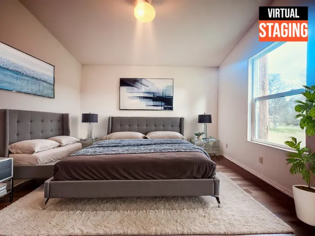 a bedroom with bed and window