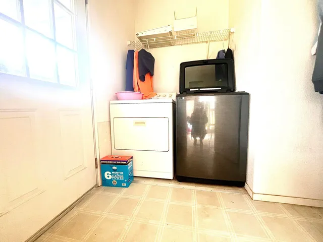 a view of living room with washer and dryer