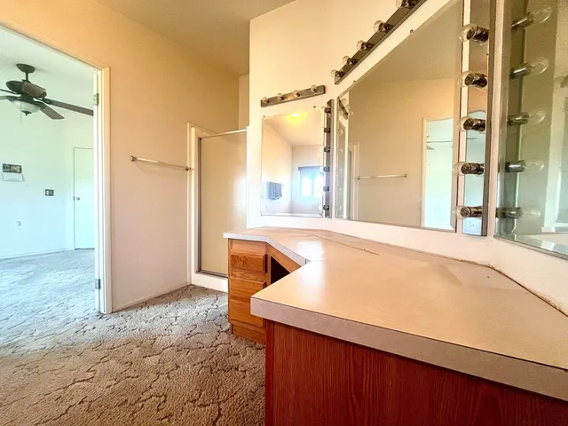 a view of a kitchen from a hallway