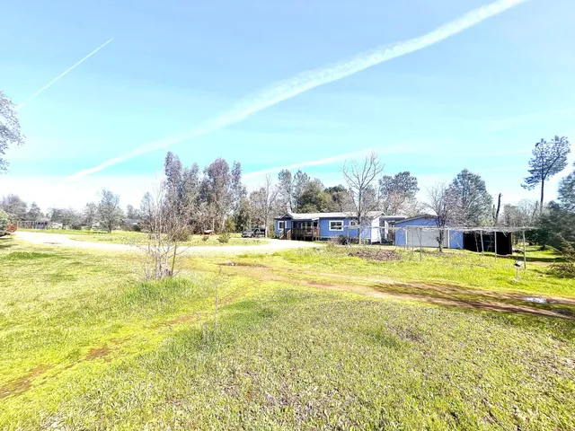 a view of a swimming pool and an outdoor space