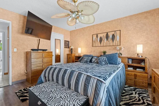 a bedroom with a bed and dresser