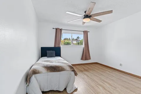 a bedroom with a bed and window