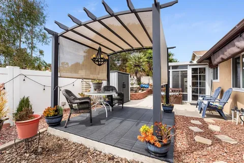 a outdoor living space with furniture and garden view