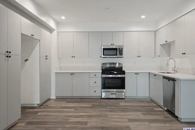 a view of hallway with wooden floor