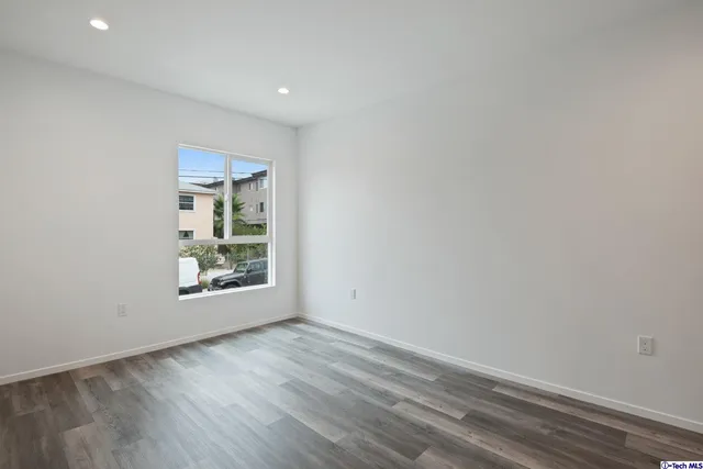 a view of a street with a building in the background