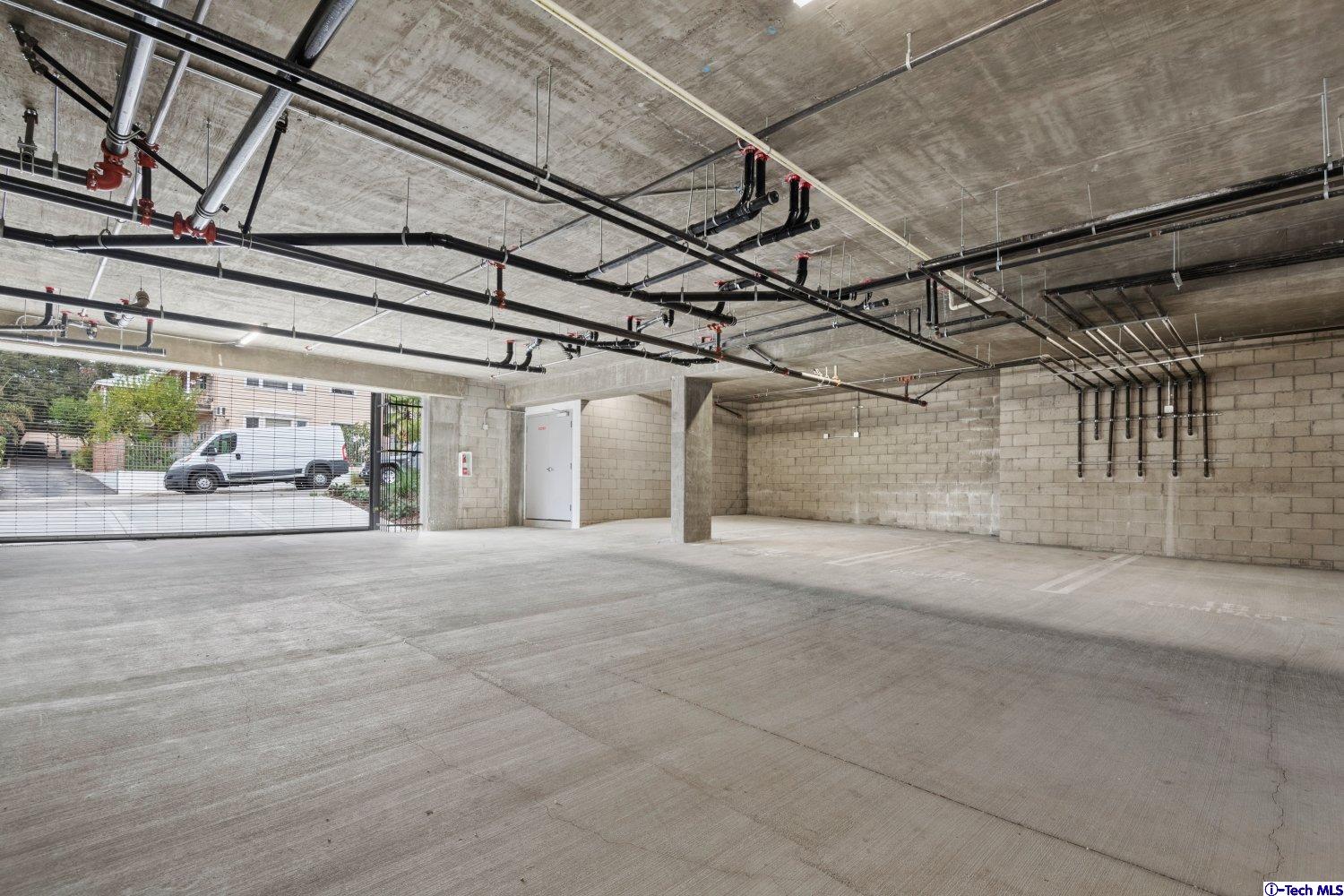7064 Greeley Street, Unit 101 Tujunga, CA 91042 - Photo 7 of 37 a view of a garage